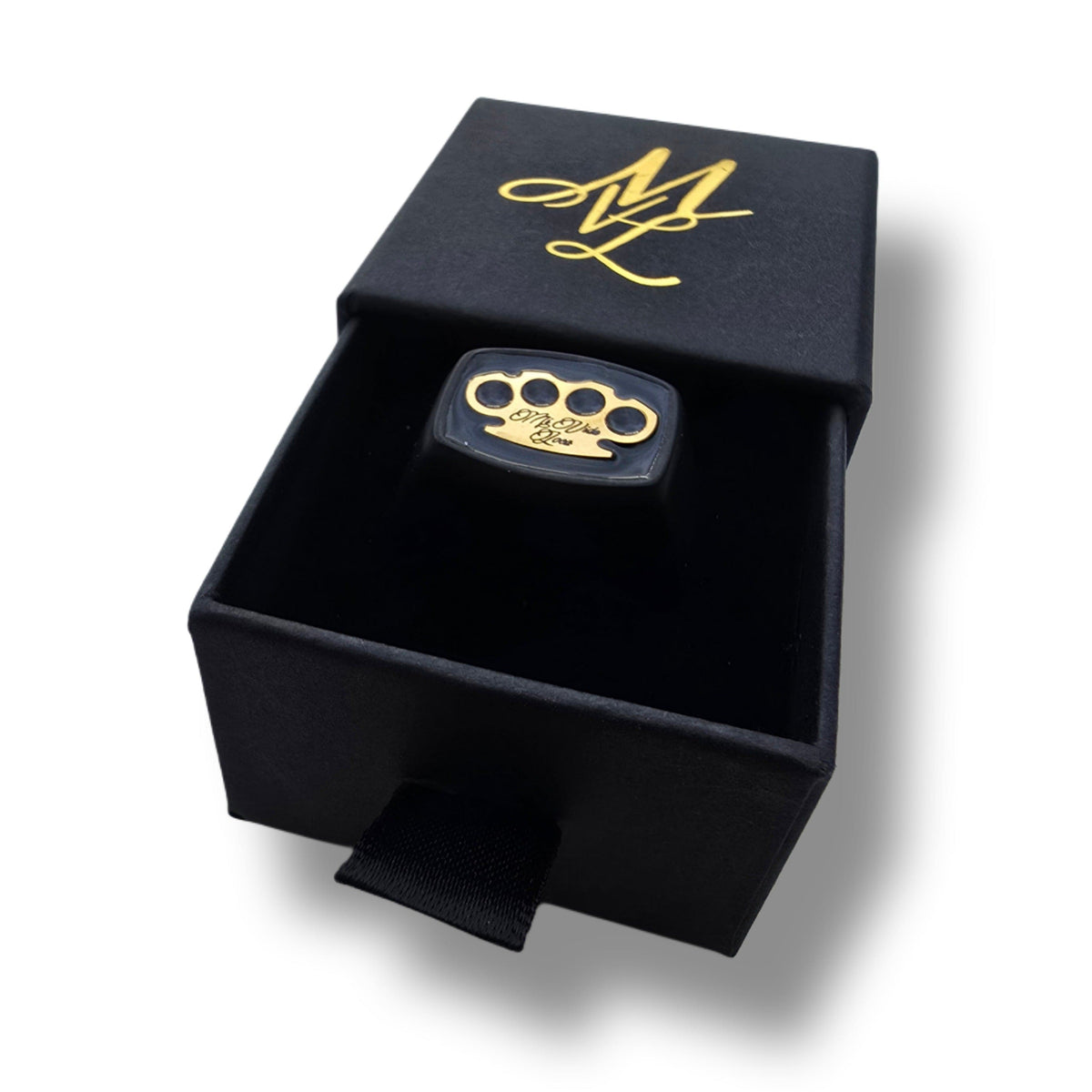 MVL Signet ring in black/gold in the open ring box with gold MVL monogram on the lid