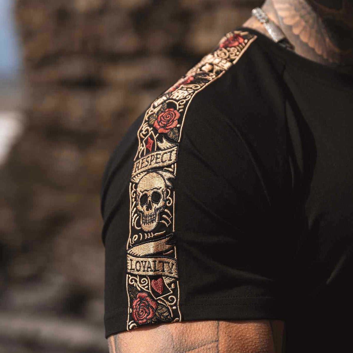 Close-up of the LFR embroidered band with skull, roses and the words Respect and Loyalty on the sleeve