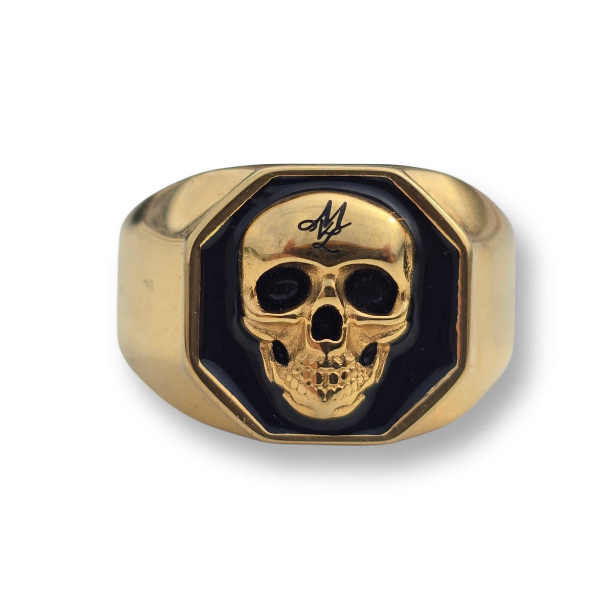 Vista frontal del anillo MVL 3D Skull dorado con calavera 3D sobre superficie negra