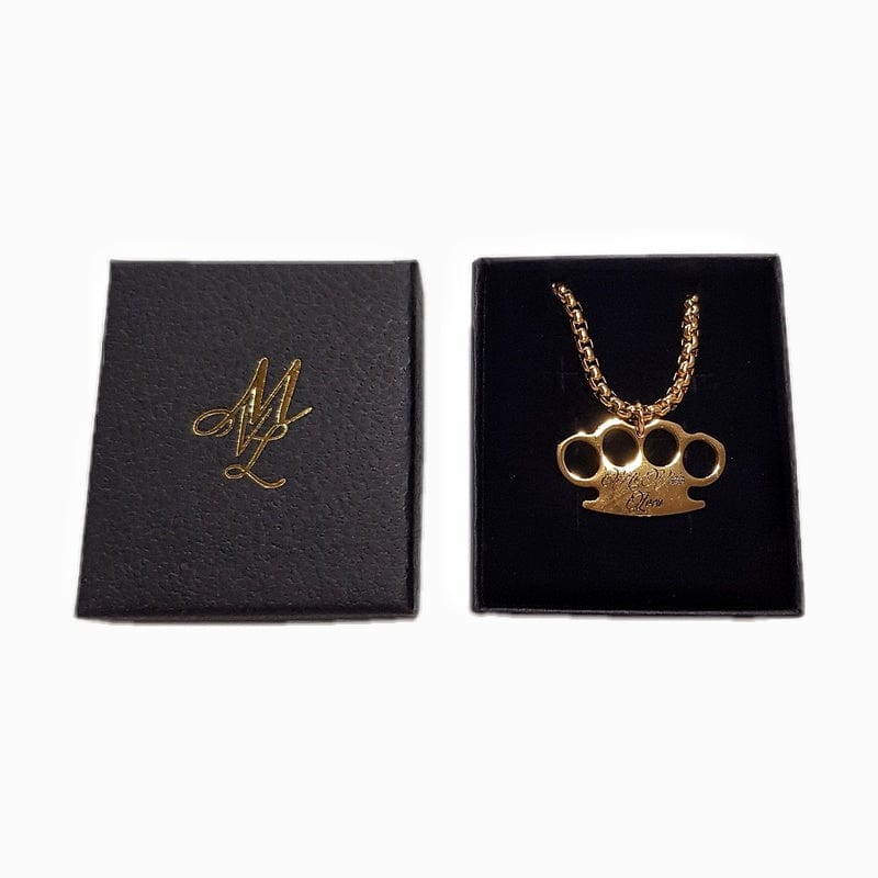 Gold MVL Logo necklace in the open black box next to the lid with gold MVL monogram